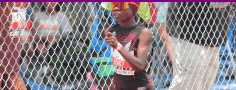 Young athlete racing on the track